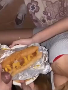 Hoodplug247 twitter image where a men in putting his semen on burger